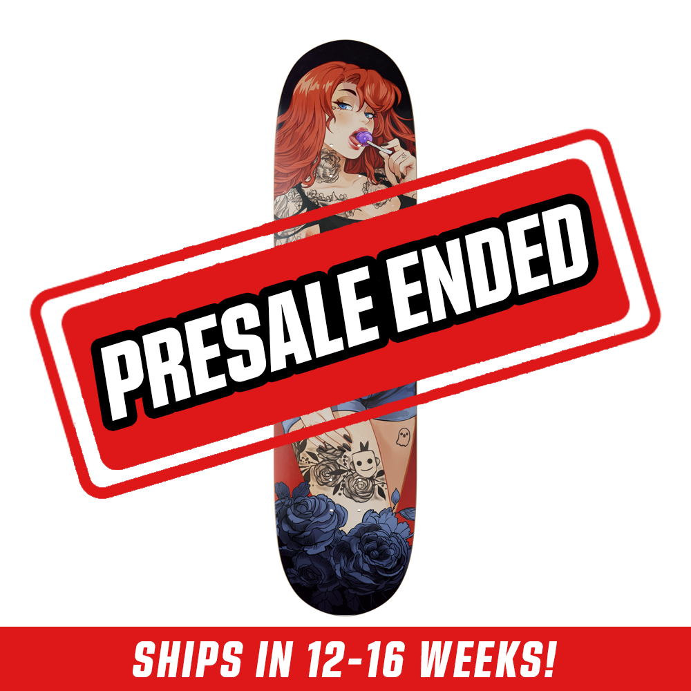 Skateboard deck with a tattooed red-haired woman in a black crop top and blue shorts, surrounded by dark blue roses.