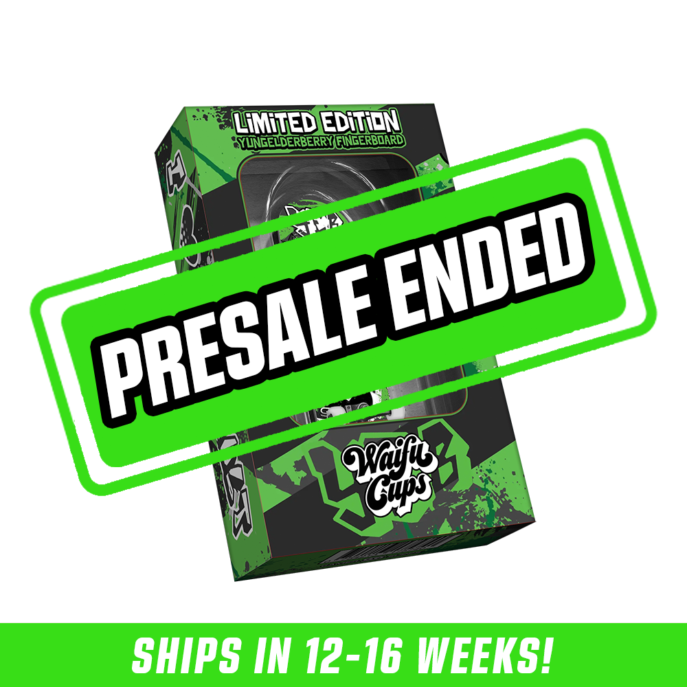 Black and green fingerboard with anime-style girl graphic in black and white, packaged in matching green and black box.