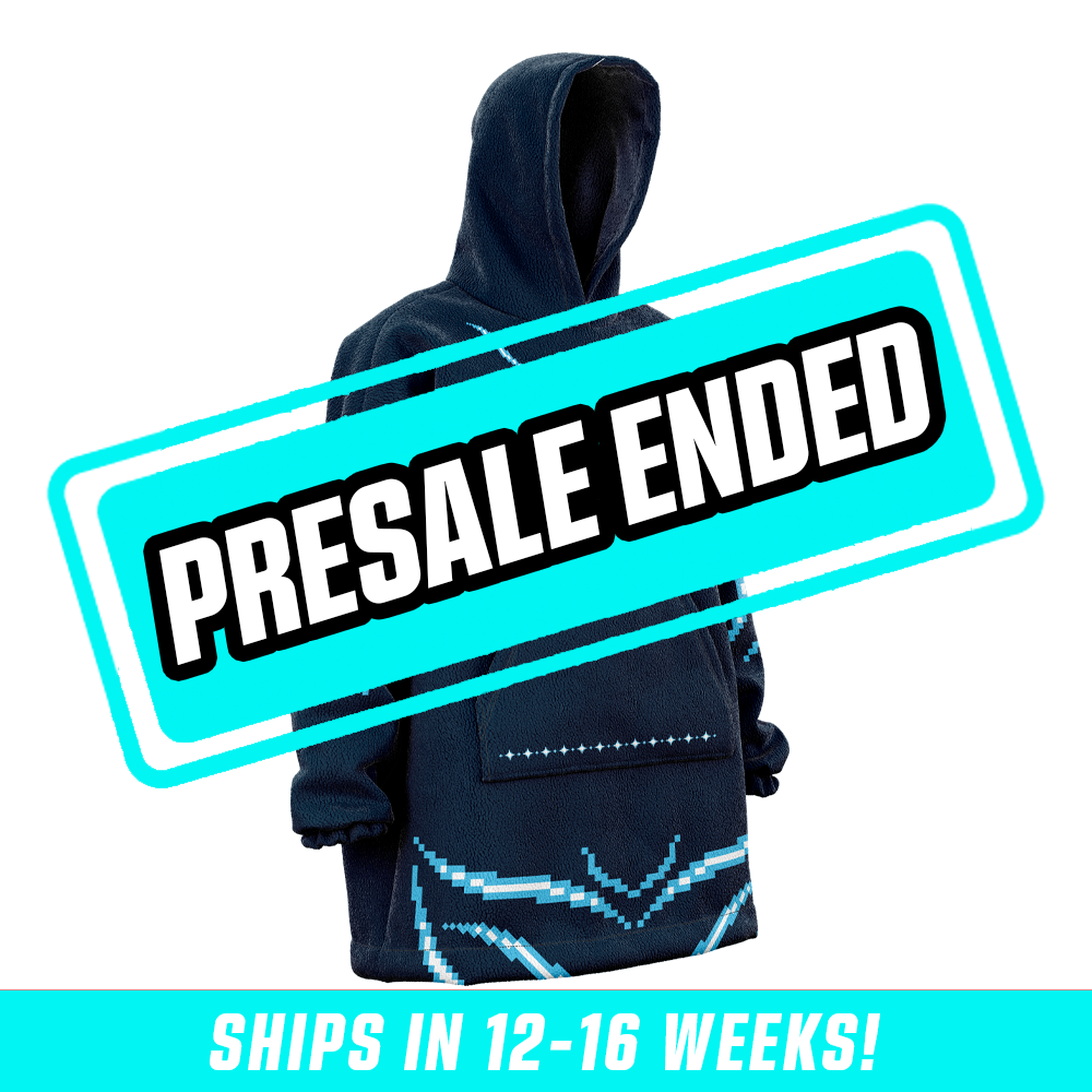 Navy blue hooded blanket with pixel art characters and light blue pixel patterns on sleeves and hem.