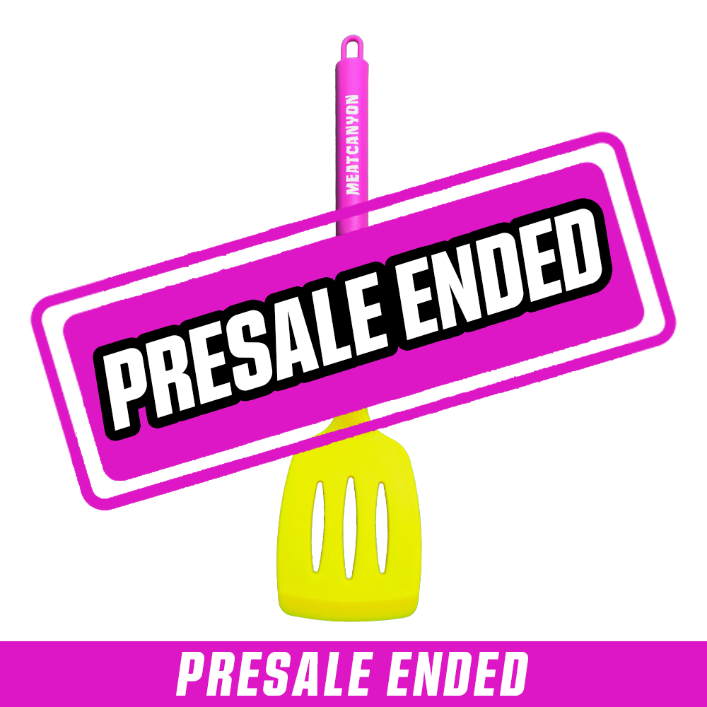 Yellow slotted spatula with a black handle and bright pink grip labeled "MEATCANYON" in white text.