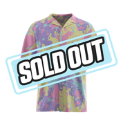 Short-sleeve button-up shirt with pastel pink, blue, yellow, and purple abstract splatter design.